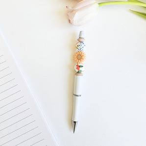 Stylo billes de silicone Marguerite corail - Bébé LoupRainbows & Lollipop