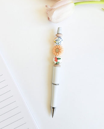 Stylo billes de silicone Marguerite corail - Bébé LoupRainbows & Lollipop